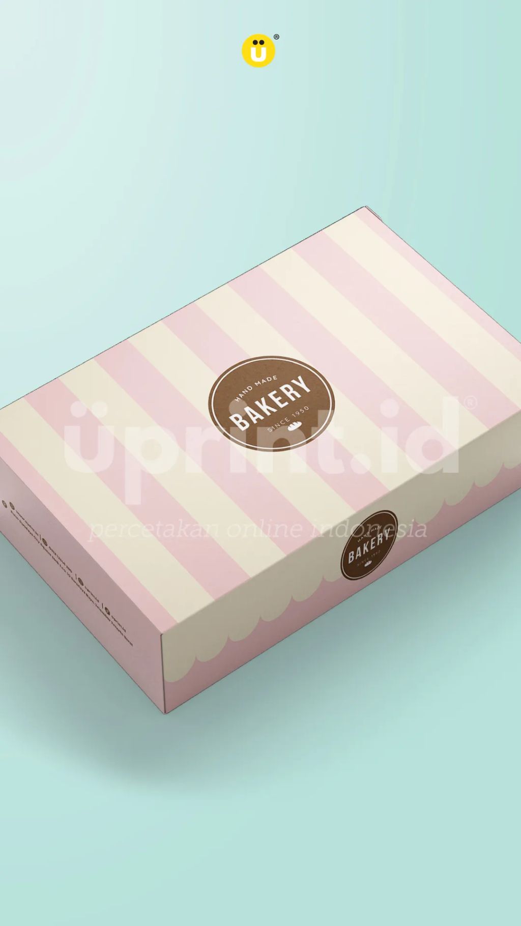 Kotak kue dengan logo Bakery sebagai contoh kemasan cetak yang memperpanjang pengalaman brand dari online ke offline