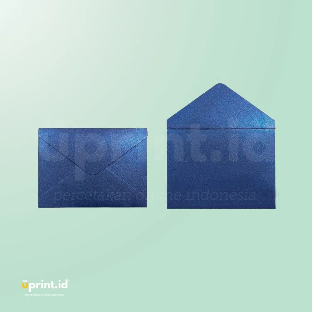 Two blue glitter envelopes on a light green background