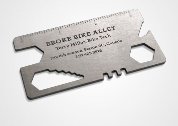 Multifunctional card tool featuring business details for Broke Bike Alley in Fernie, BC, Canada.