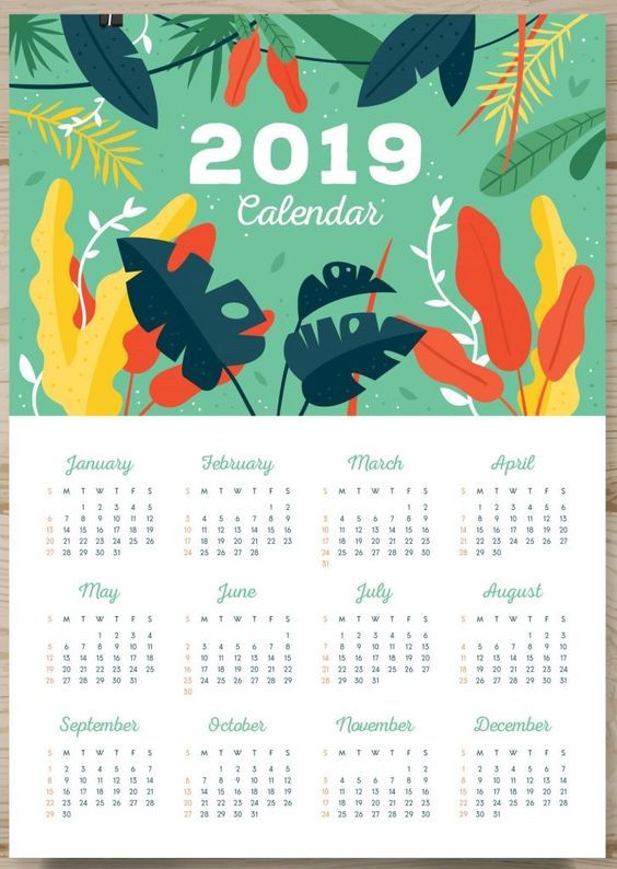 Kalender 2019 dengan ilustrasi daun tropis dan angka bulan-bulan