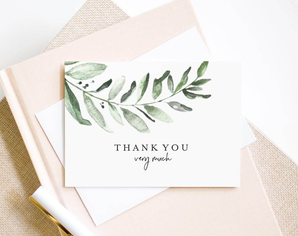 Kartu terima kasih putih dengan motif daun hijau dan tulisan 'Thank you very much'.