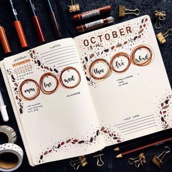 Halaman buku catatan dengan desain kalender bulanan Oktober dan elemen visual menarik.