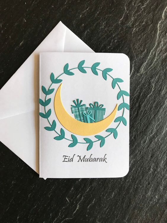 Kartu ucapan Idul Fitri dengan bulan sabit dan hadiah
