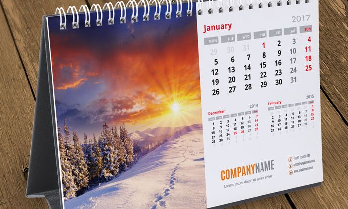 Kalender meja dengan foto pemandangan dan area tanggal yang jelas untuk branding di meja kerja.