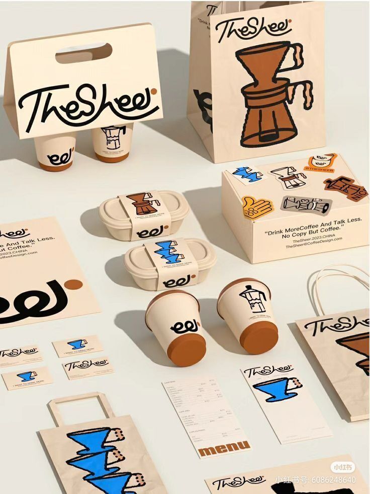 Display of branding materials for 'TheShee' coffee shop, featuring cups, bags, and promotional items.