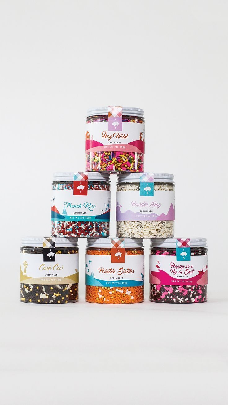 Assorted colorful sprinkles in labeled jars for baking and decorating.