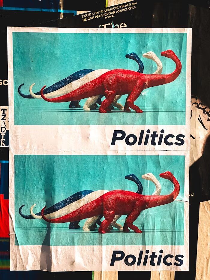 Gambar dinosaurus dengan latar belakang biru dan tulisan 'Politics' di bawahnya.