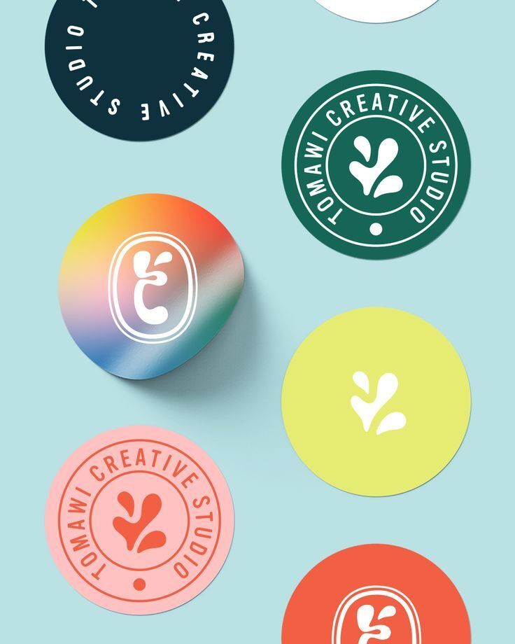 Stiker warna-warni dengan logo studio kreatif Tomawi Creative Studio