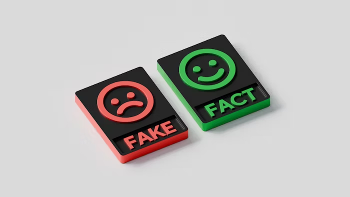 Simbol warna merah 'FAKE' dan hijau 'FACT' untuk menandai informasi palsu dan benar.