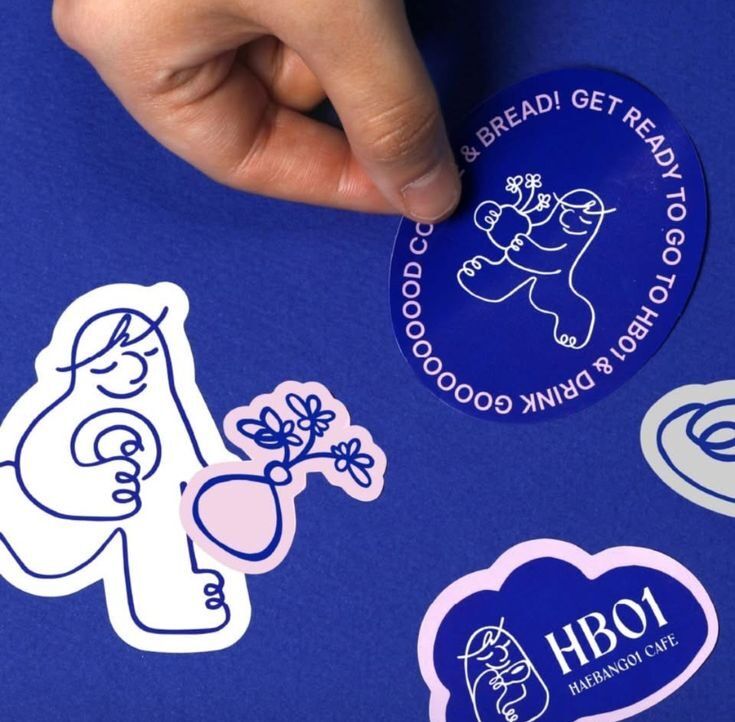 Stiker biru dengan tulisan dan gambar lucu, cocok untuk promosi cafe.