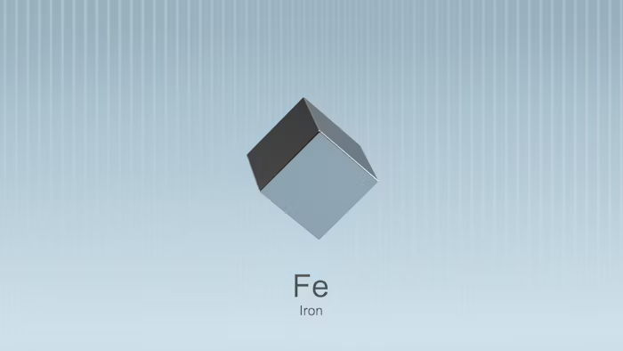 Gambar kubus besi dengan notasi kimia Fe dan nama Iron.