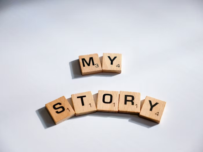 Tile Scrabble 'MY STORY' on a white background