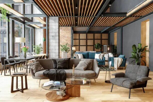 Ruang tamu minimalis dengan sofa modern, meja kaca, dan hiasan tanaman.