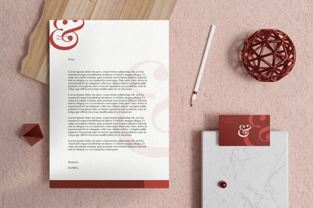 Contoh surat perusahaan dengan desain elegan dan elemen dekoratif merah.