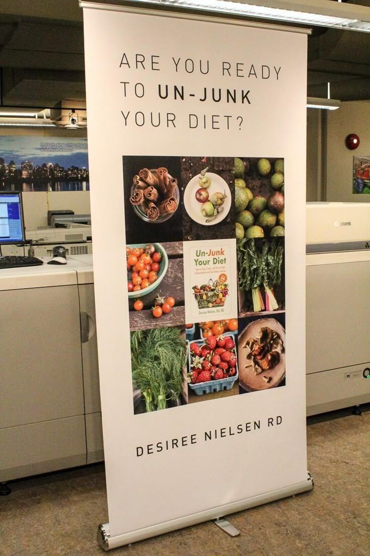 Banner promosi diet sehat dengan makanan segar dan buku Un-Junk Your Diet.