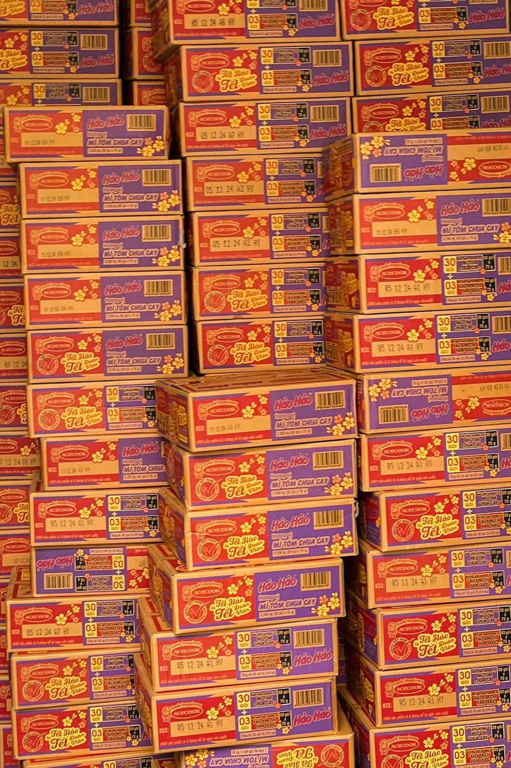 Stacked boxes with colorful labels and barcodes, ideal for packaging or promotional materials.