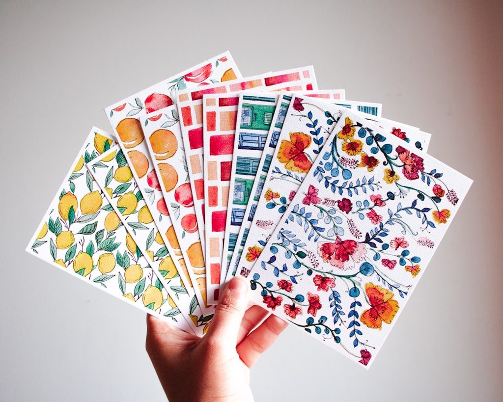 Holding a variety of floral and fruit-themed stickers for decorative purposes.