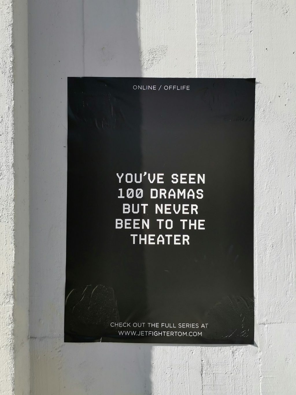 Poster bertuliskan You ve seen 100 dramas but never been to the theater dengan latar hitam dan putih.
