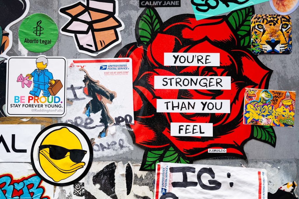 Motivational sticker featuring a rose and the text 'You're stronger than you feel'.