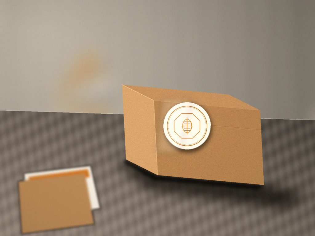 Stiker label brand premium pada kemasan kraft dengan aksen foil elegan di studio percetakan digital.