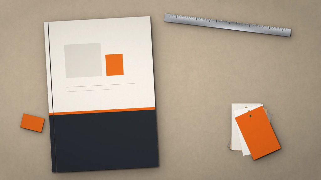 Contoh cetak thin hard cover A4 company profile eksklusif di atas meja meeting