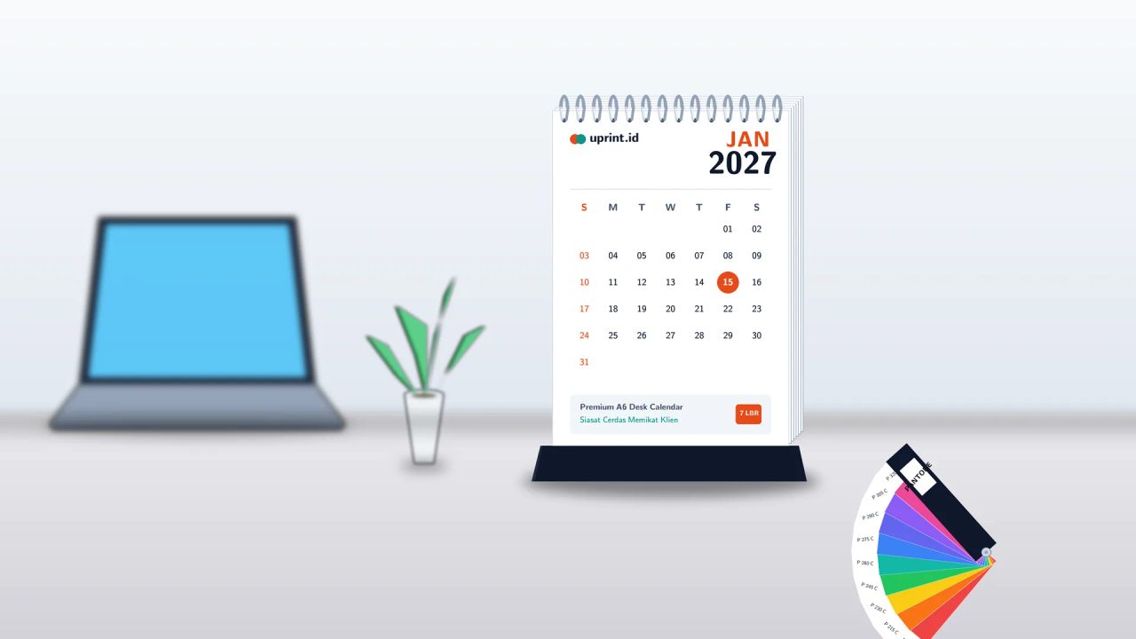 Ilustrasi kalender meja A6 portrait branded 7 lembar Uprint.id di atas meja kerja modern dengan Pantone color guide