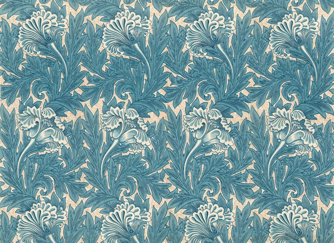 Gambar dekoratif floral dengan pola estetis dan warna biru laut.