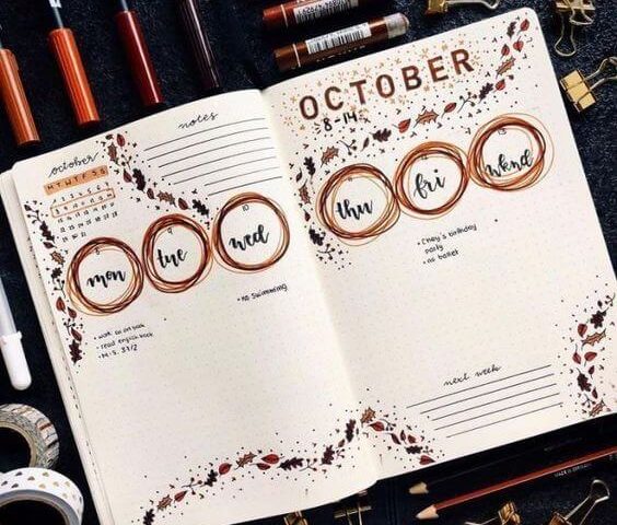 Halaman buku catatan dengan desain kalender bulanan Oktober dan elemen visual menarik.