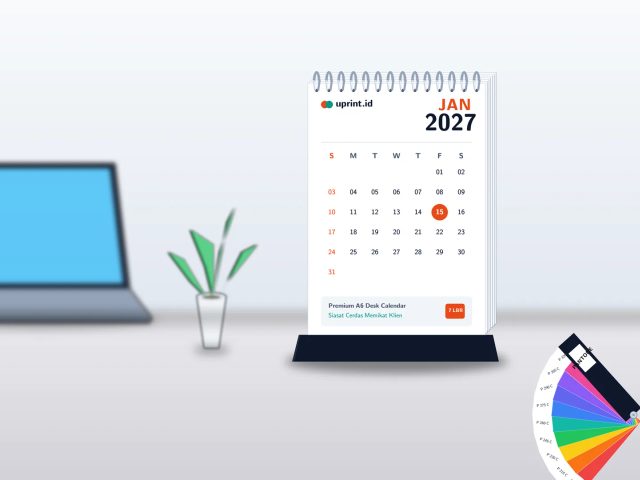 Ilustrasi kalender meja A6 portrait branded 7 lembar Uprint.id di atas meja kerja modern dengan Pantone color guide