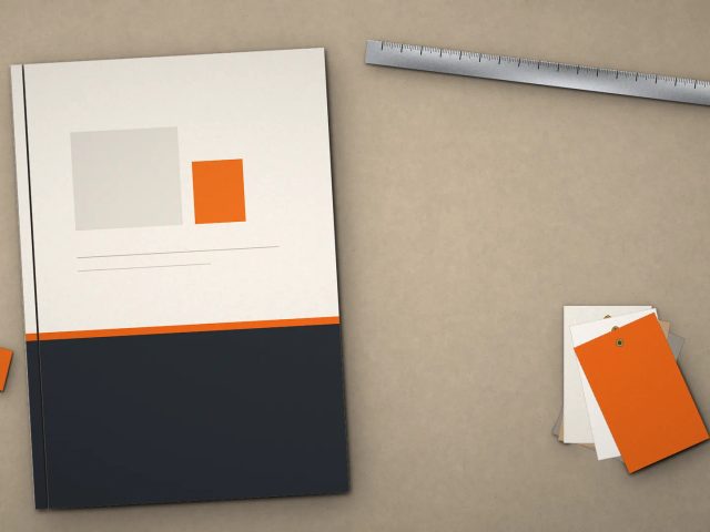 Contoh cetak thin hard cover A4 company profile eksklusif di atas meja meeting